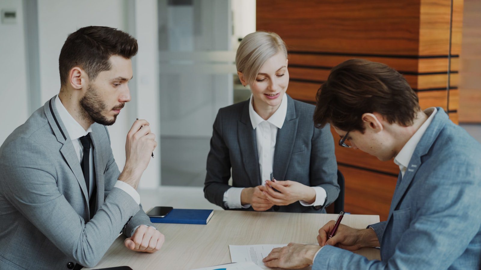 AI Governance Platforms: 7 Critical Reasons to Act 20 business team signing compliance documents for AI regulation