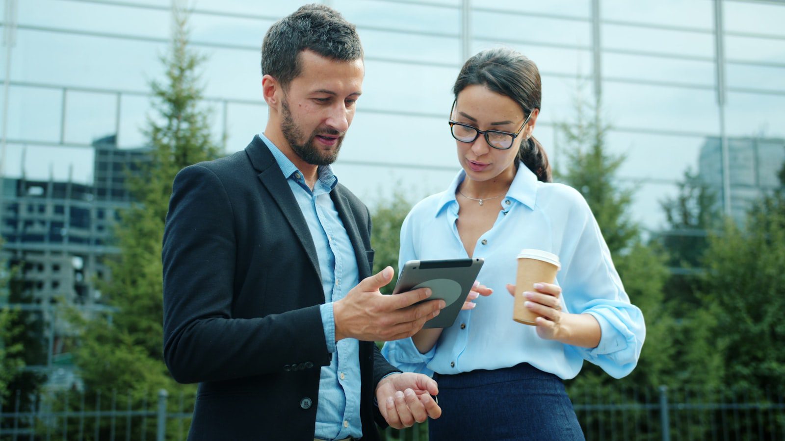 AI Governance Platforms: 7 Critical Reasons to Act 24 business team reviewing AI governance implementation roadmap on tablet