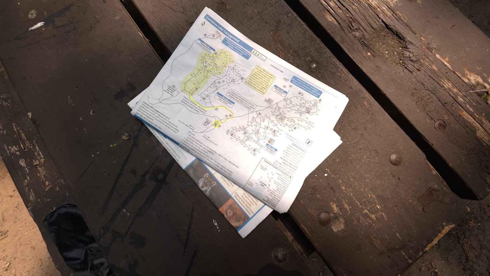 Ask Maps: 7 Powerful Ways Gemini Makes Travel Smarter 19 Ask Maps FAQ represented by route papers and map planning notes on a wooden table