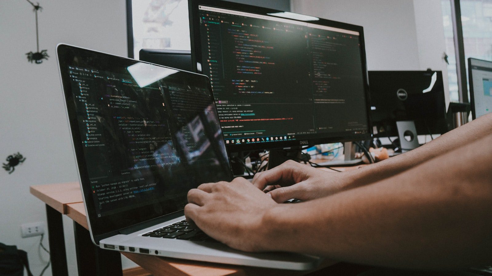 Code Execution with MCP: 7 Powerful Agent System Lessons 10 Person typing on a laptop representing agent tool delegation and workflow execution