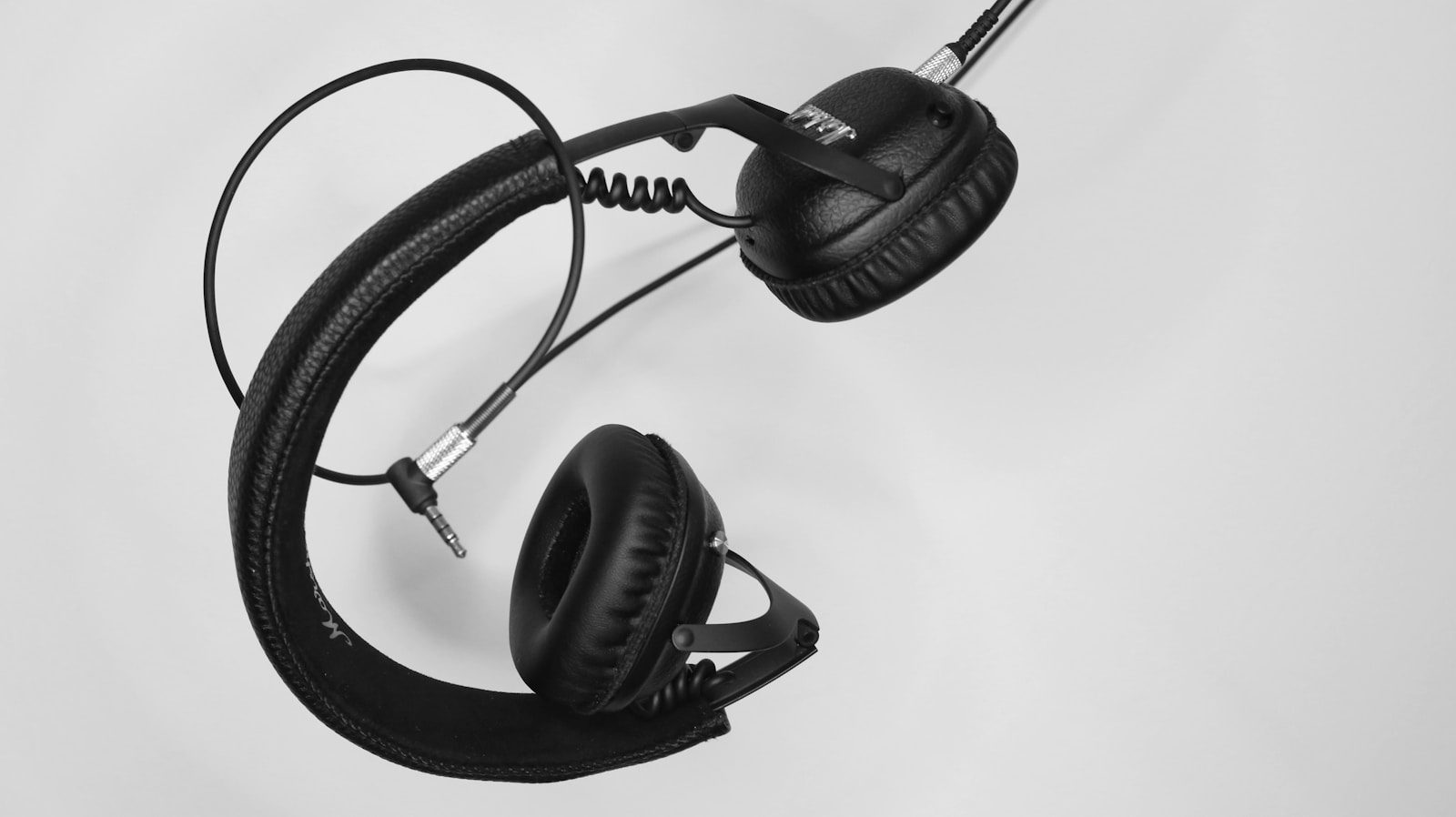 Deepfake Phishing: 7 Powerful Real-Time AI Defenses 31 Headphones representing common voice phishing and deepfake phishing FAQ questions