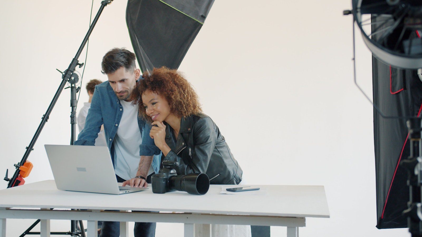HitPaw AI Marvels: 7 Smart Ways Creators Win 18 Creators comparing AI photo and video app alternatives on a laptop