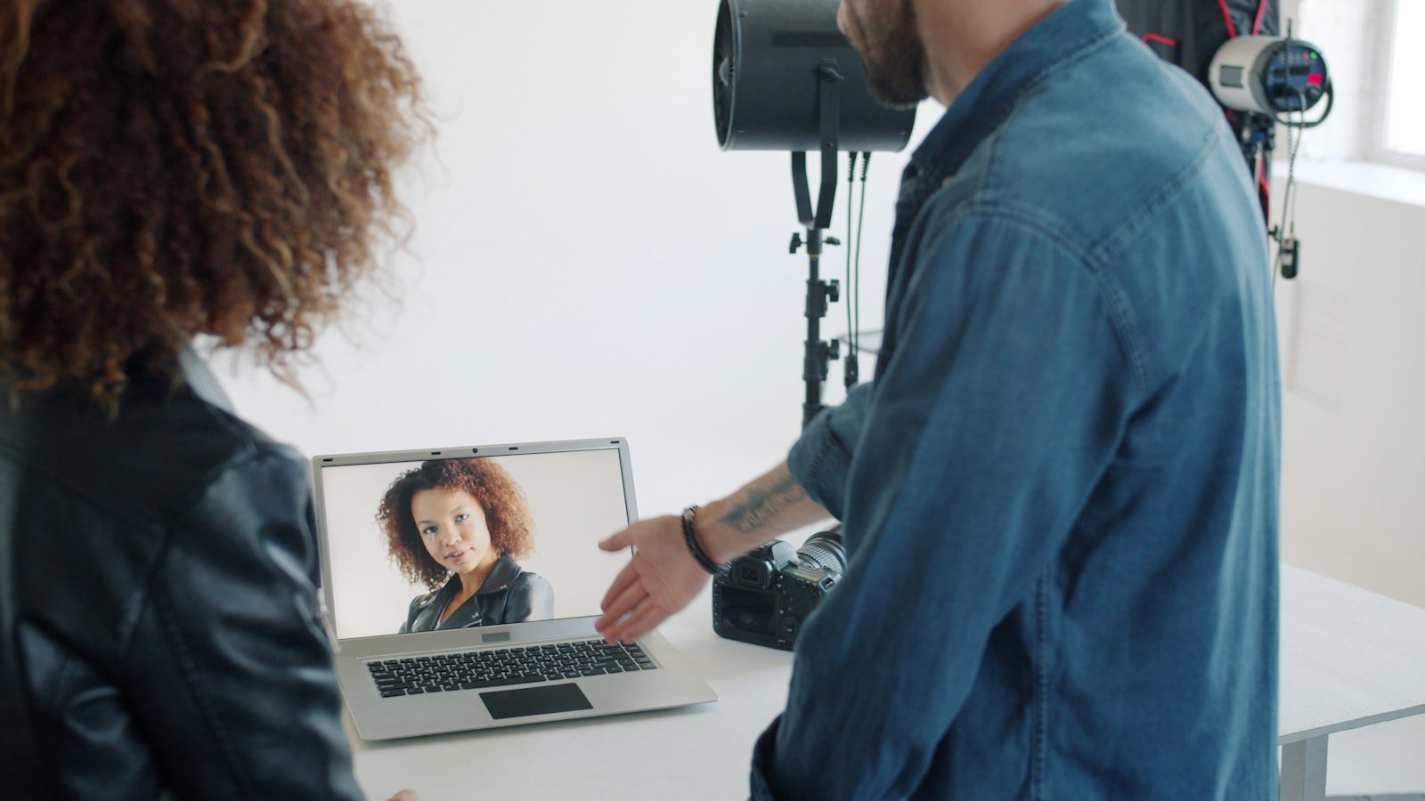 HitPaw AI Marvels: 7 Smart Ways Creators Win 15 Creative team reviewing a portrait workflow on a laptop