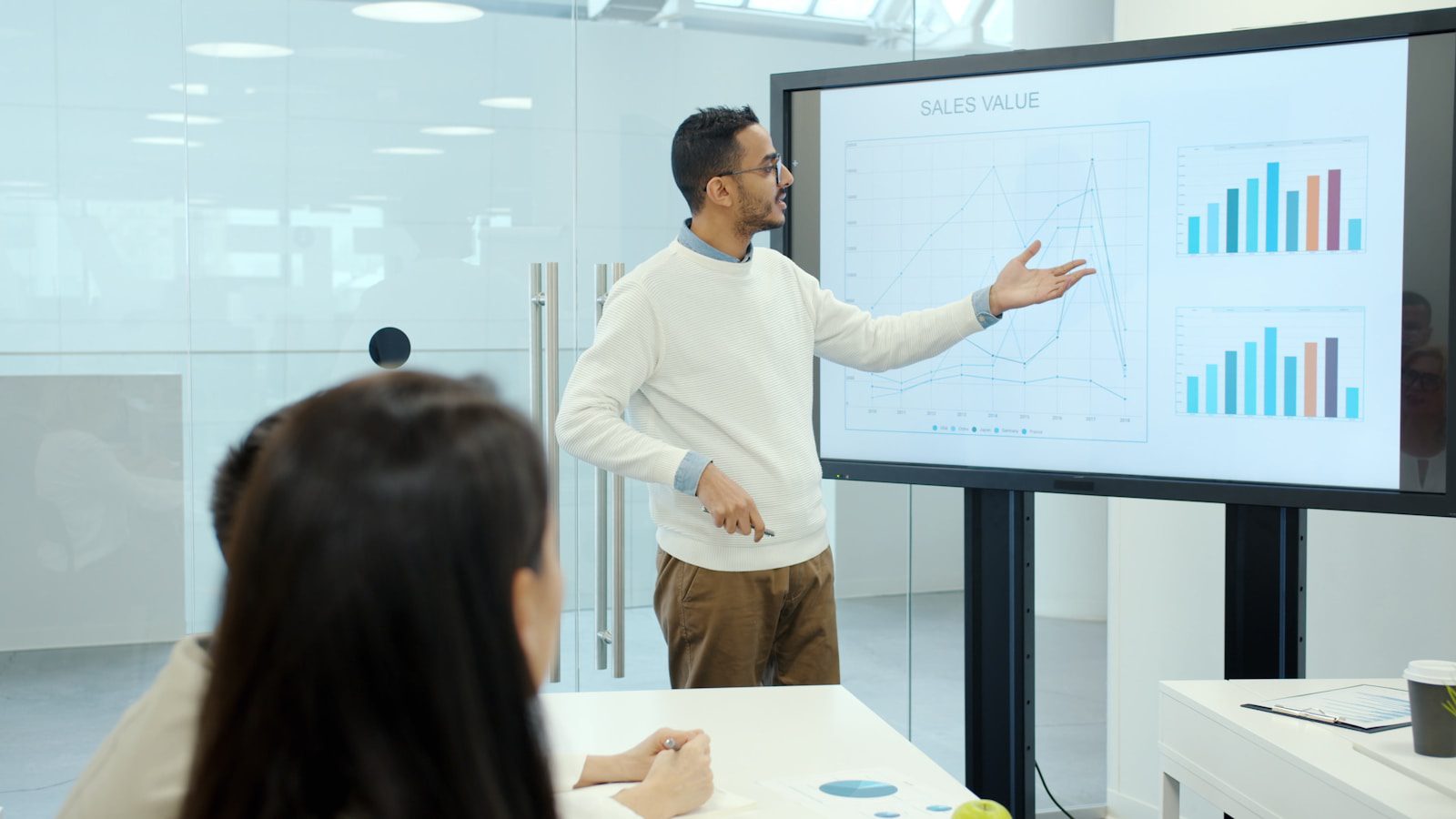 Sovereign AI: 7 Vital Privacy Reasons Localized LLMs Win 19 business leader presenting cost and performance metrics for localized LLM infrastructure