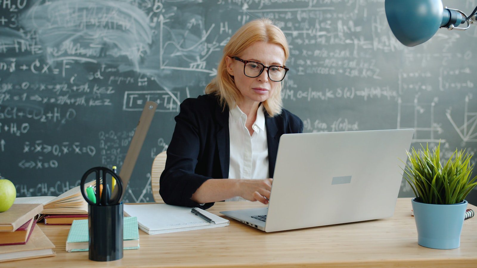 Trainn AI Review: 7 Powerful Customer Training Lessons 16 Trainn AI review showing a customer education professional working on laptop training content