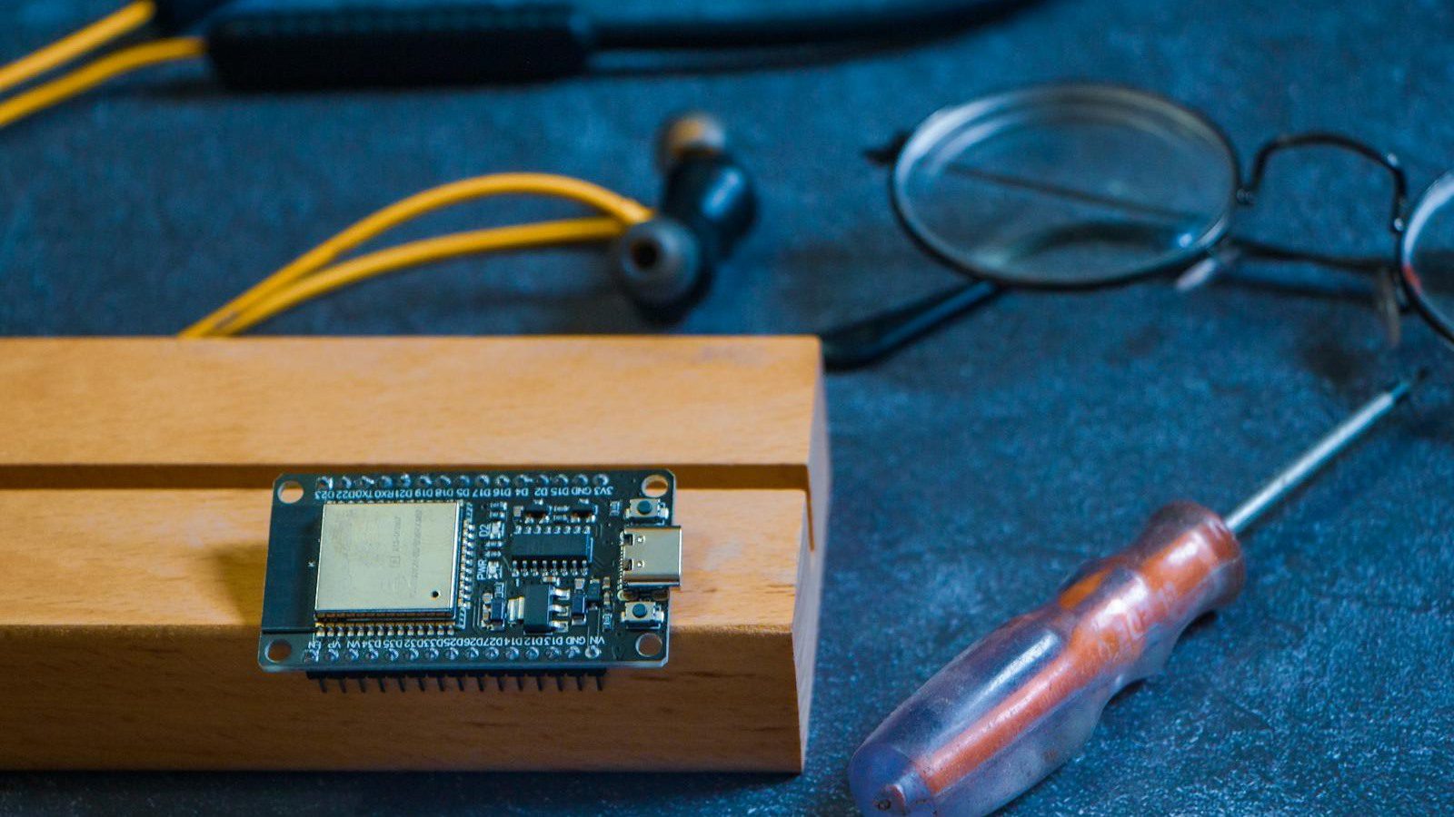 Arduino circuit board on a workbench representing an IoT pilot roadmap