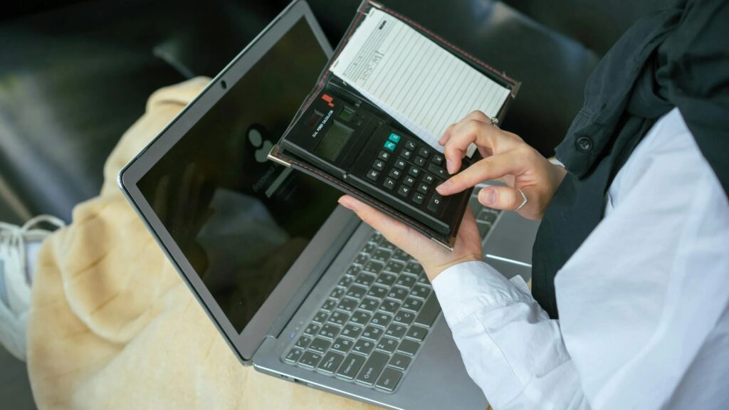 Business Central finance controls shown through accounting documents calculator and laptop