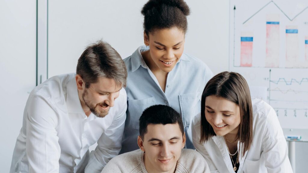 Co-Managed IT specialists reviewing cyber cloud and automation work with internal IT