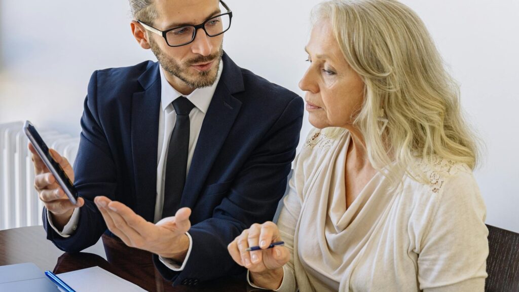 ERP consultant guiding business leaders through implementation strategy in a modern meeting room