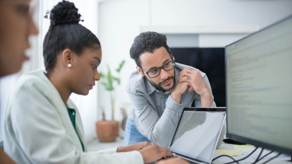 ERP consultant reviewing technical integrations and system design with a software team
