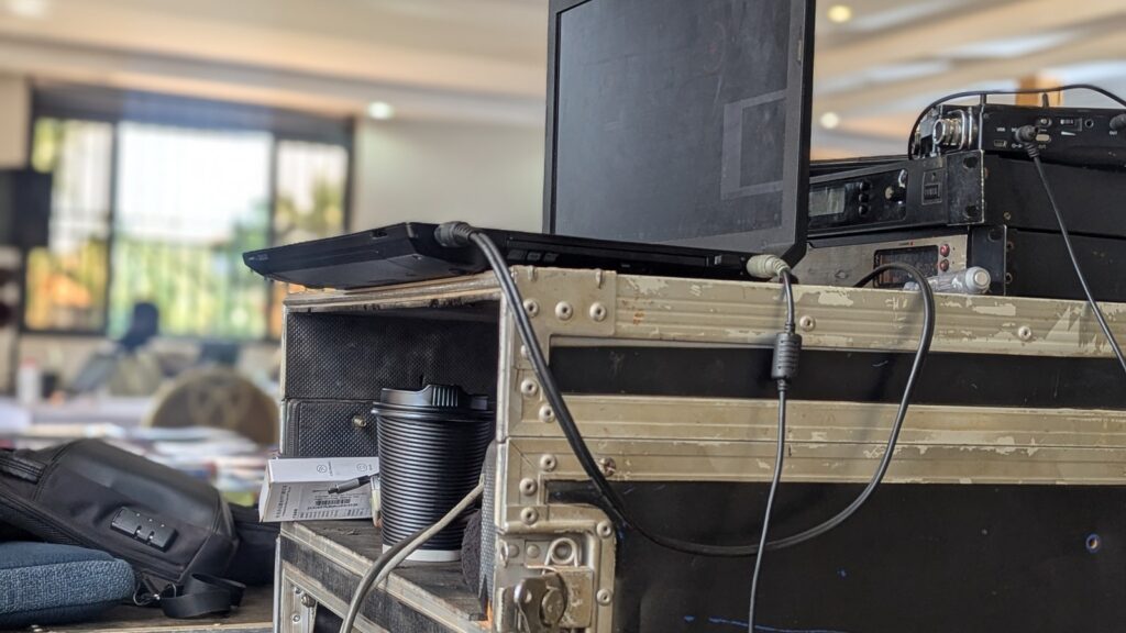 GPT-5.5 Costs shown by a cabled laptop setup representing tool-heavy AI workflows