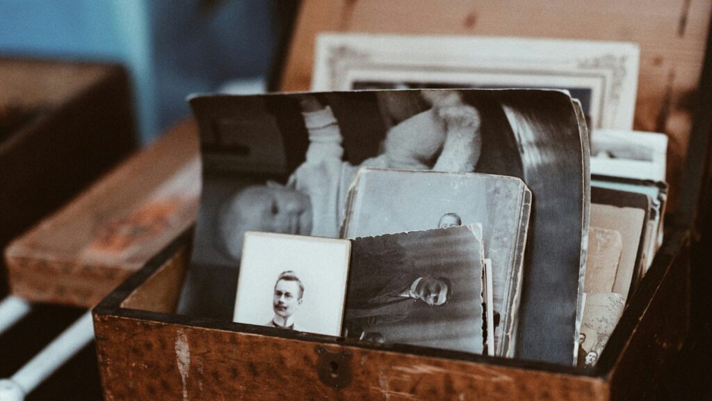 HitPaw Photo Restoration at-a-glance section represented by old photos stored in a wooden chest.
