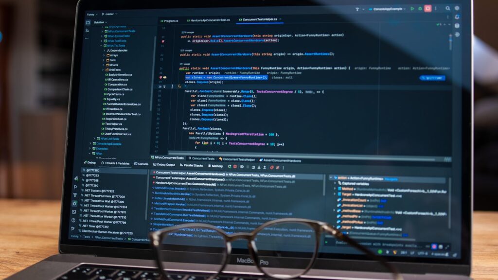 Intent-Based Chaos Testing metrics dashboard with debugging software on a laptop