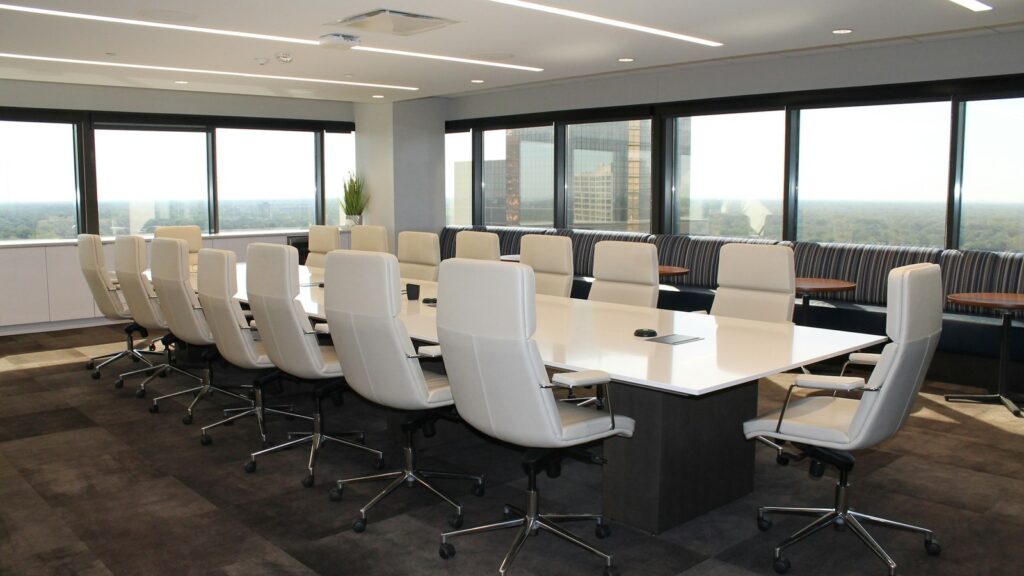 Empty conference room chairs and table representing a controlled Li-Fi security zone