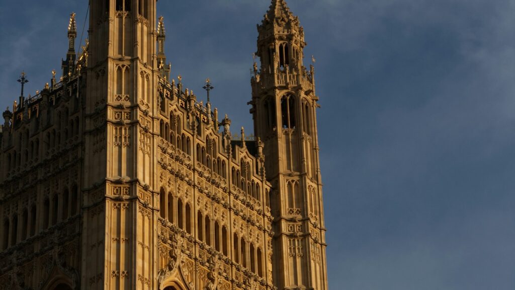 Union Jack above a gothic UK government building representing public-sector Li-Fi security needs