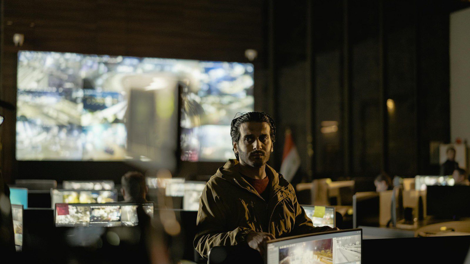 Multimodal AI shown through a modern control room combining video screens alerts and operational data