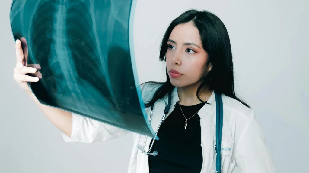 Multimodal AI healthcare use case shown through a doctor examining a chest X-ray