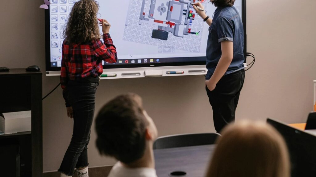 Multimodal AI education use case shown through students working with robotics in a classroom