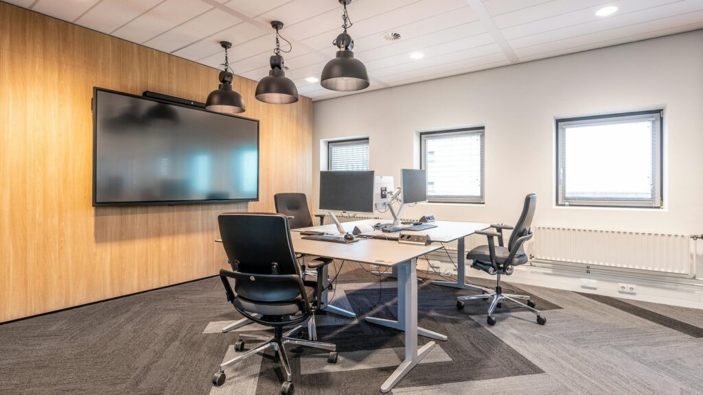Perplexity Computer shown in a meeting room for governance rollout and review controls