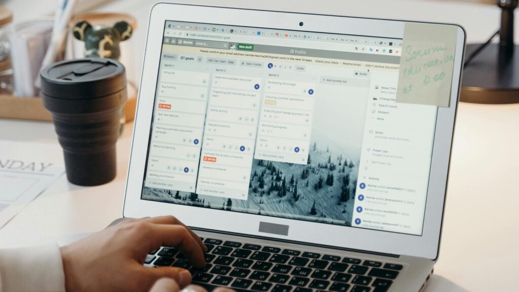Power Automate vs Zapier Microsoft workflow setup on a laptop with project management software