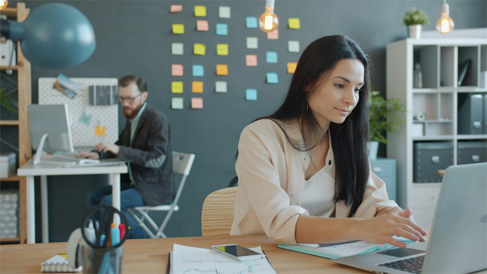 professional working on a laptop in a modern office for faster product decisions