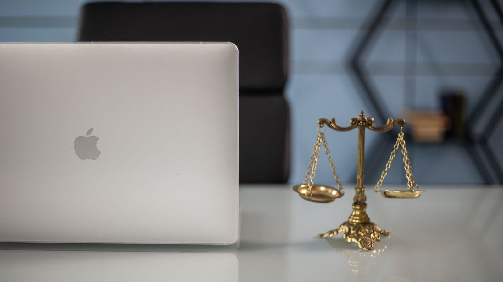 enterprise AI data governance consulting: laptop beside scales of justice for AI copyright liability review