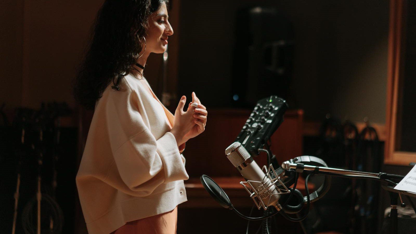 AI Video Translator Review: 7 Smart Localization Wins 13 speaker recording voice in a studio representing lip sync and natural AI dubbing output
