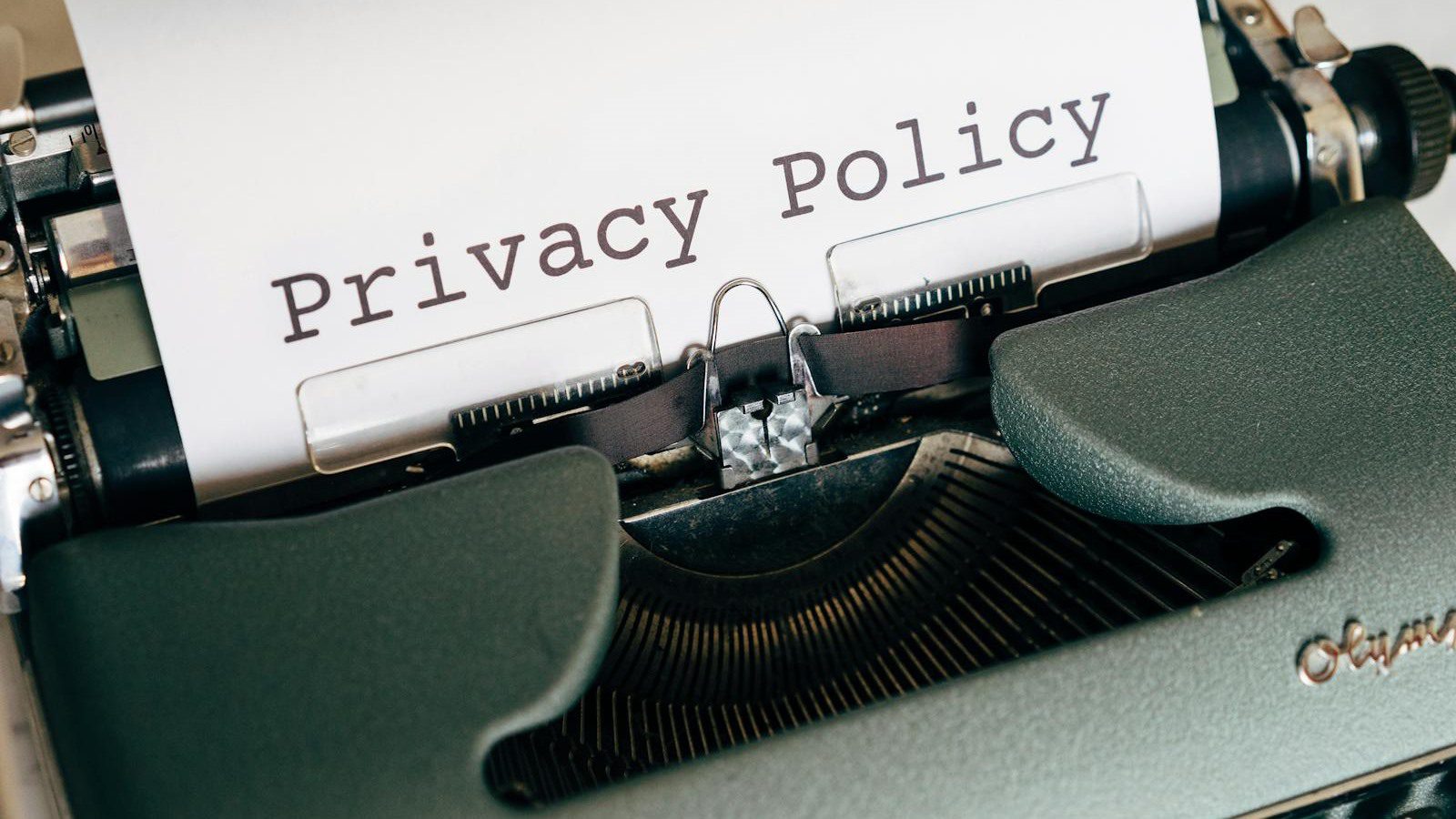 Atoms Review: 7 Smart Ways to Build AI Apps Faster 17 privacy policy document in a typewriter representing data governance checks for AI app builders