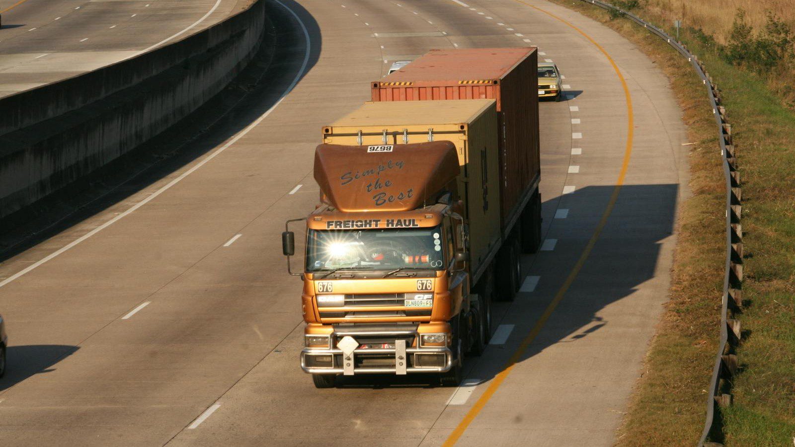 autonomous fleet telematics: freight truck on a highway producing vehicle sensor data.