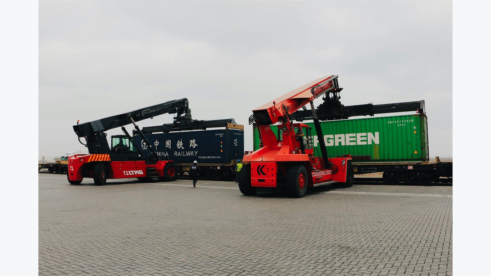 forklifts unloading cargo containers representing chain of custody events between logistics partners