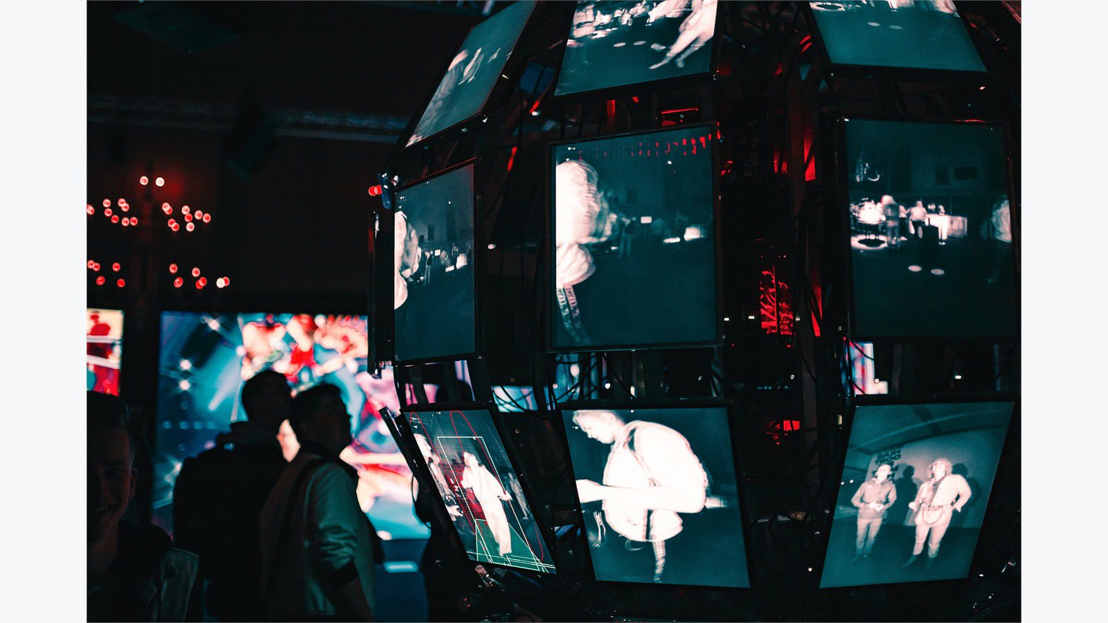 team reviewing connected screens representing governance for multi-party blockchain supply chain networks