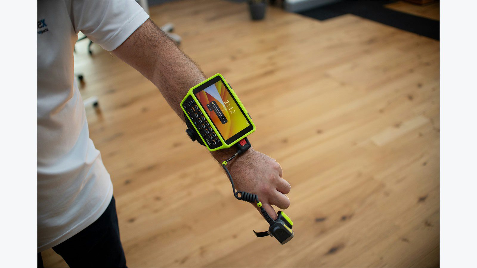 wearable barcode scanner representing IoT RFID ERP and warehouse data feeding trusted supply chain events