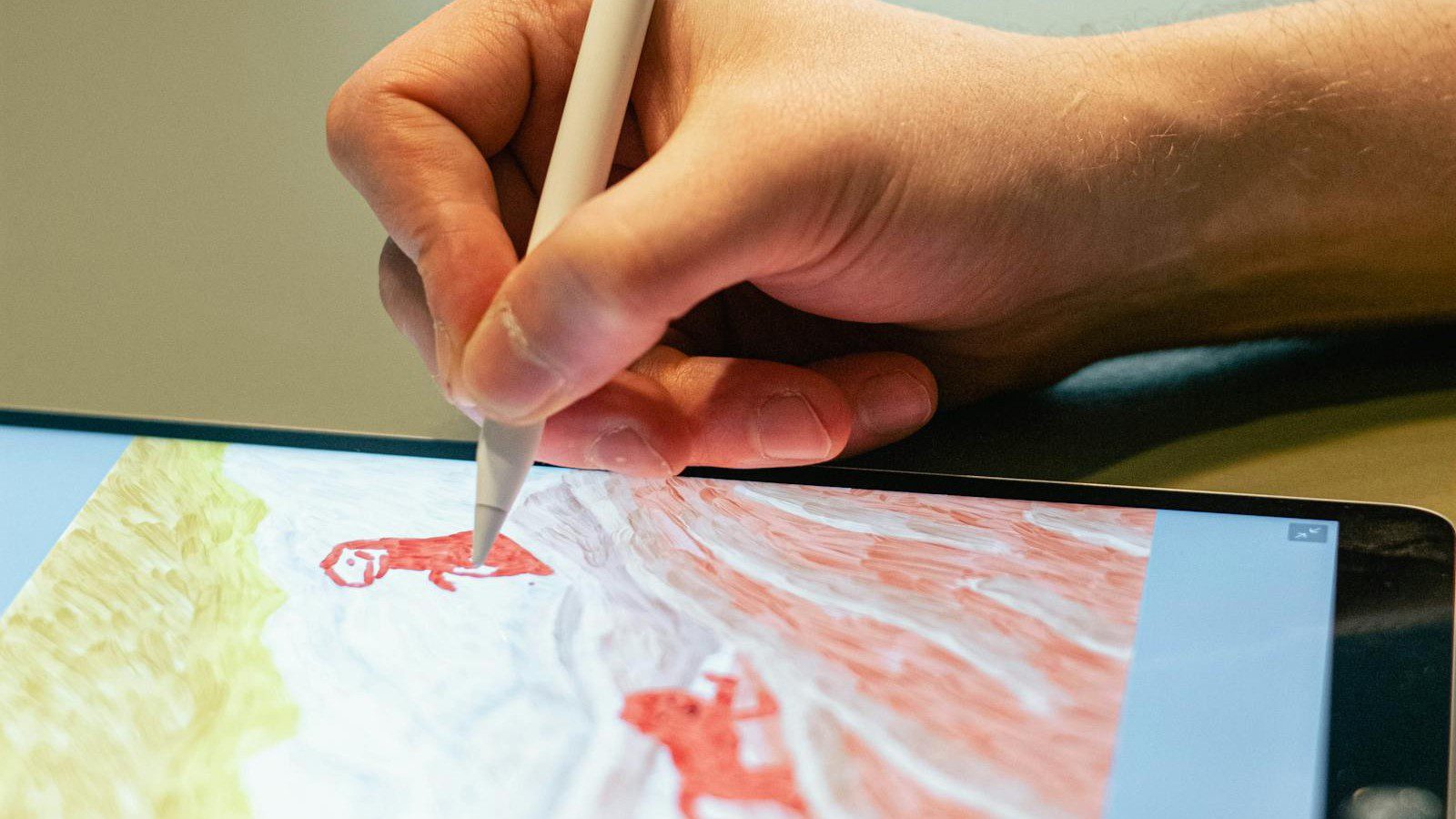 ComicInk: A Practical Guide to AI Comic Creation and Creator Stores 6 ComicInk: artist sketching on a tablet for digital comic creation