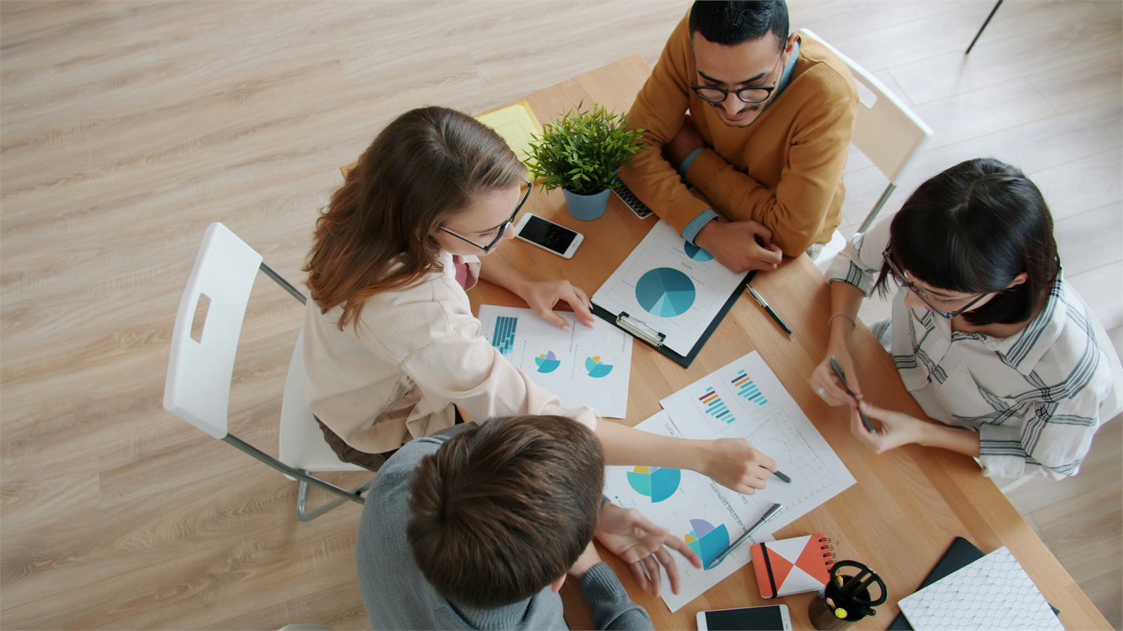 Cost of Downtime: 9 Powerful ROI Wins for Smart Leaders 14 business team mapping critical services and outage scope around charts during resilience planning
