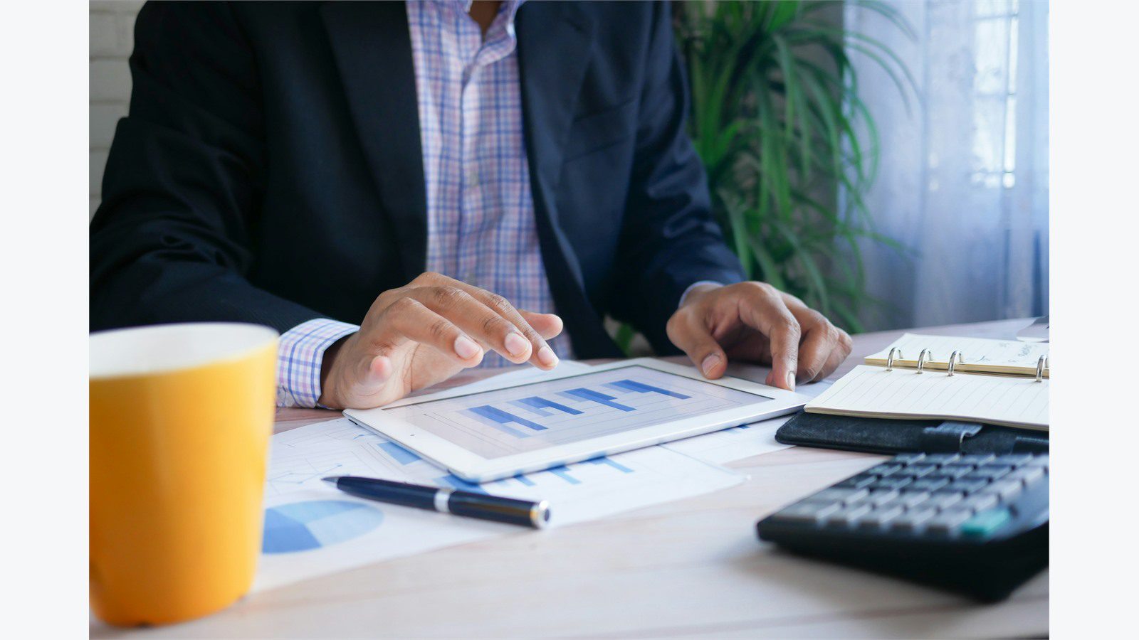 Cost of Downtime: 9 Powerful ROI Wins for Smart Leaders 16 finance leader reviewing reports and calculator representing productivity loss and recovery labor