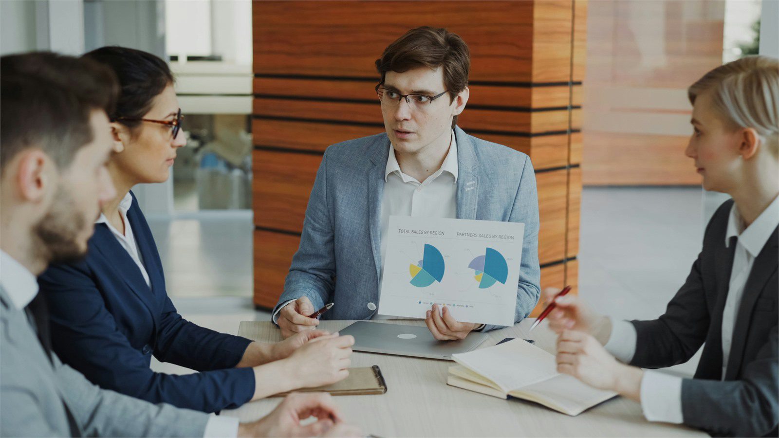 Cost of Downtime: 9 Powerful ROI Wins for Smart Leaders 21 executive meeting with charts representing downtime ROI payback and risk-adjusted value