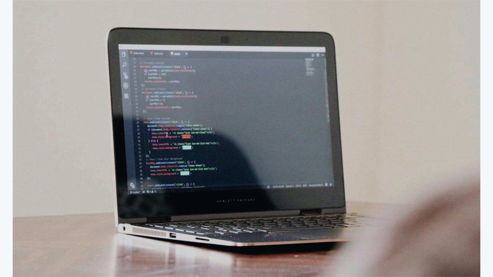 Custom Mobile ERP App: 7 Powerful Integration Steps 16 developer laptop with programming code for API middleware and direct ERP integration