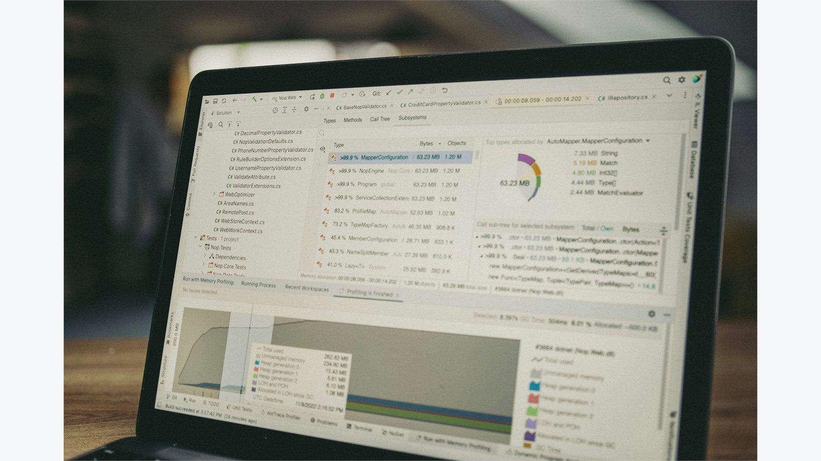 Custom Mobile ERP App: 7 Powerful Integration Steps 15 laptop dashboard showing code and data charts for mapping mobile screens to ERP fields