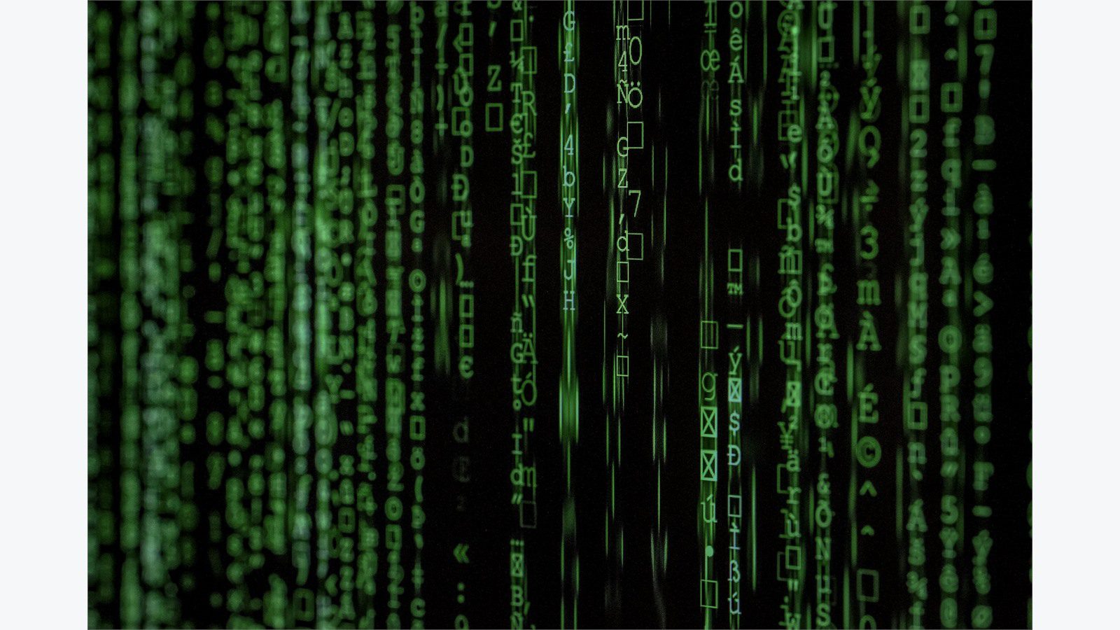 5 Cybersecurity Mistakes That Could Cost Your Small Business Everything 9 Binary code matrix screen representing the real financial cost of cybersecurity mistakes for small businesses