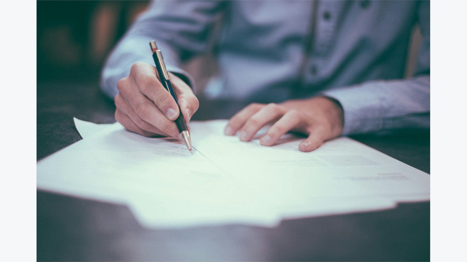 5 Cybersecurity Mistakes That Could Cost Your Small Business Everything 14 Business professional writing an incident response plan to fix cybersecurity mistakes before a breach occurs