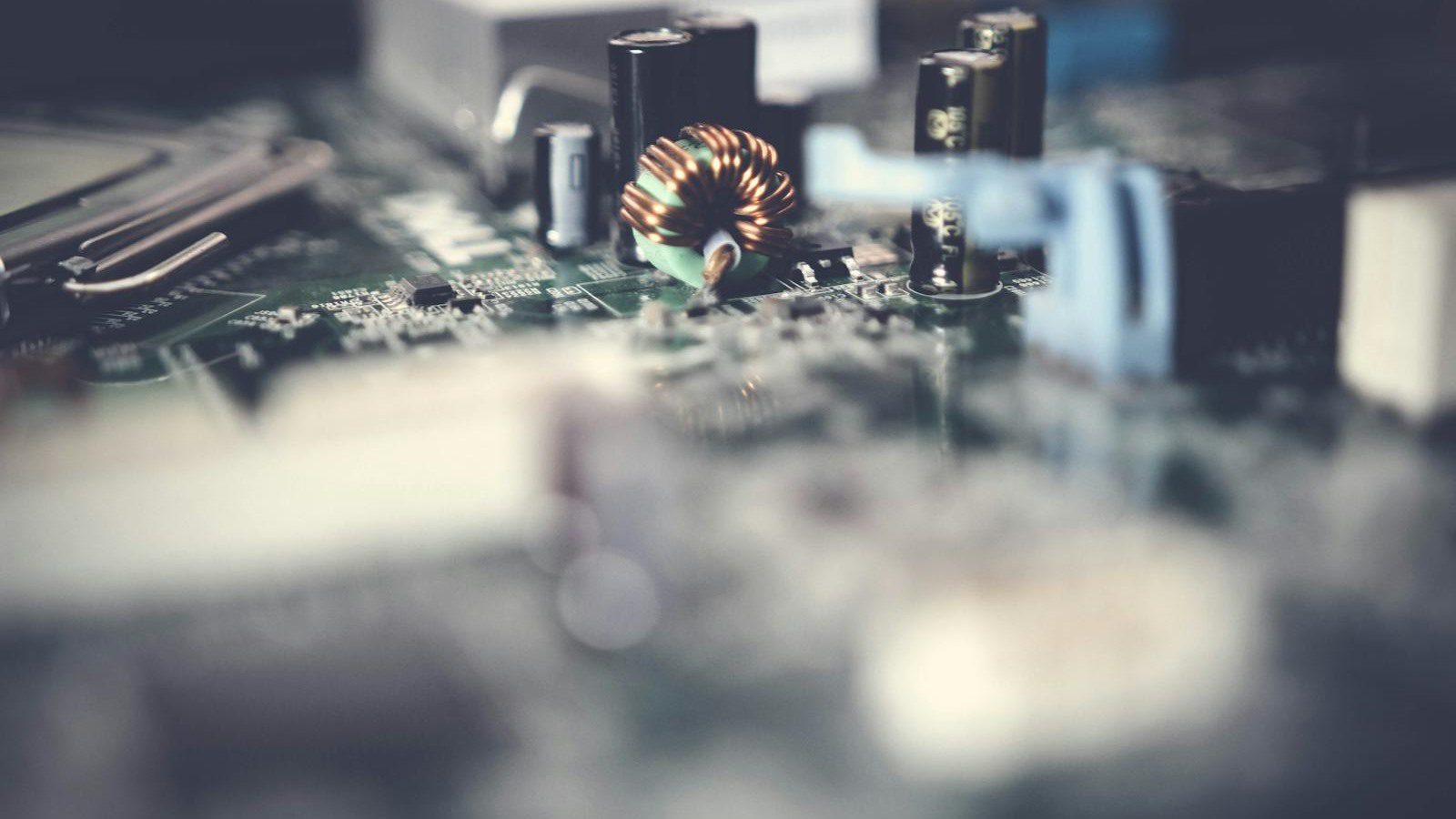 Digital Carbon Footprint: 7 Powerful Ways to Cut It 16 close-up motherboard image representing efficient software and lower energy websites