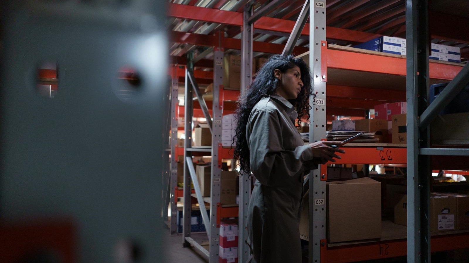 DLT Supply Chain Tracking: 7 Secure Wins Beyond Crypto 19 DLT supply chain tracking FAQ with warehouse worker checking inventory in an aisle