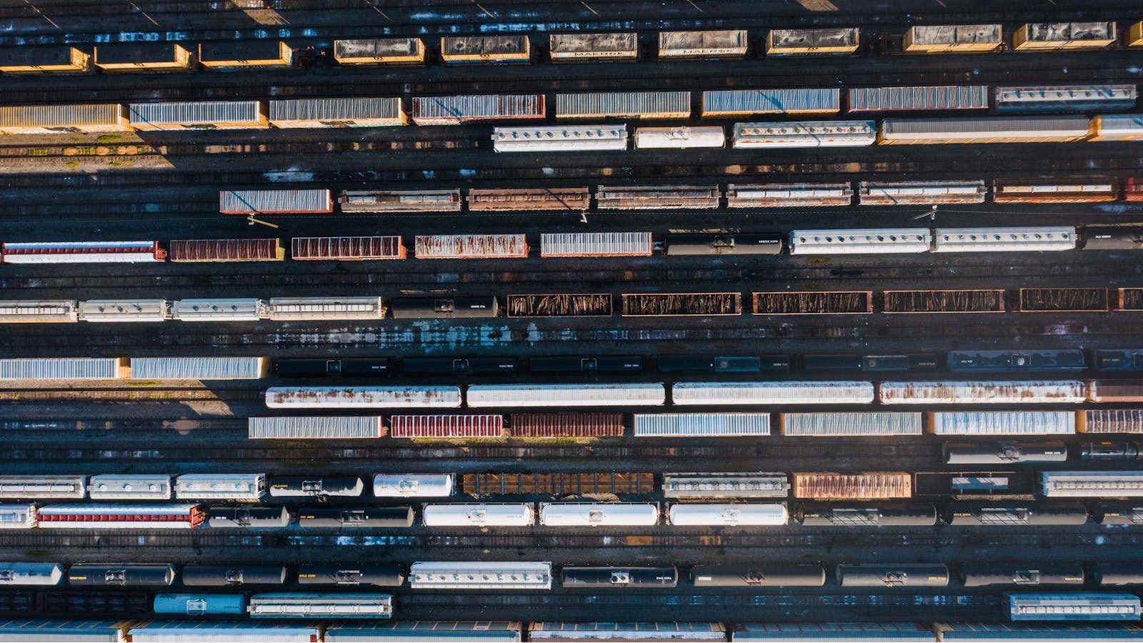 DLT Supply Chain Tracking: 7 Secure Wins Beyond Crypto 15 rows of shipping containers representing permissioned partner networks for global supply chain visibility