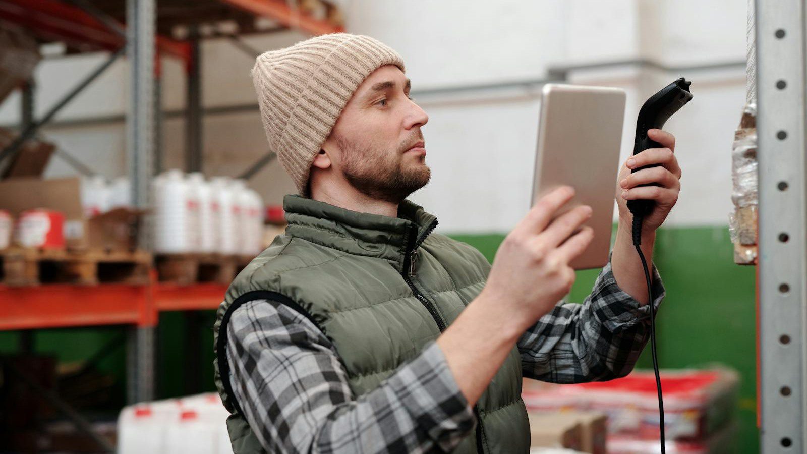 DLT Supply Chain Tracking: 7 Secure Wins Beyond Crypto 12 warehouse worker scanning inventory to create tamper evident product histories and custody records