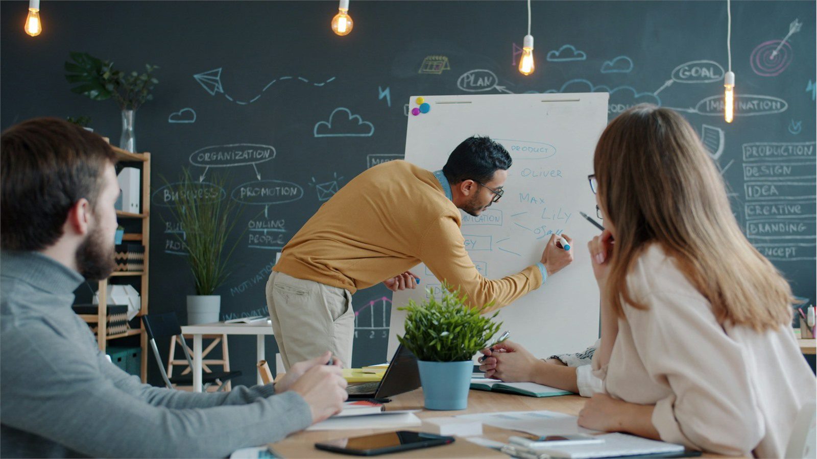 team planning ERP alternatives rollout on a whiteboard for a medium-sized business