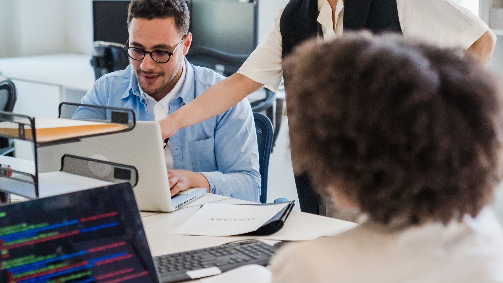 Google Workspace vs Microsoft 365: A Practical Buyer's Guide for Teams 6 Google Workspace vs Microsoft 365: a professional using a collaboration app on a laptop.