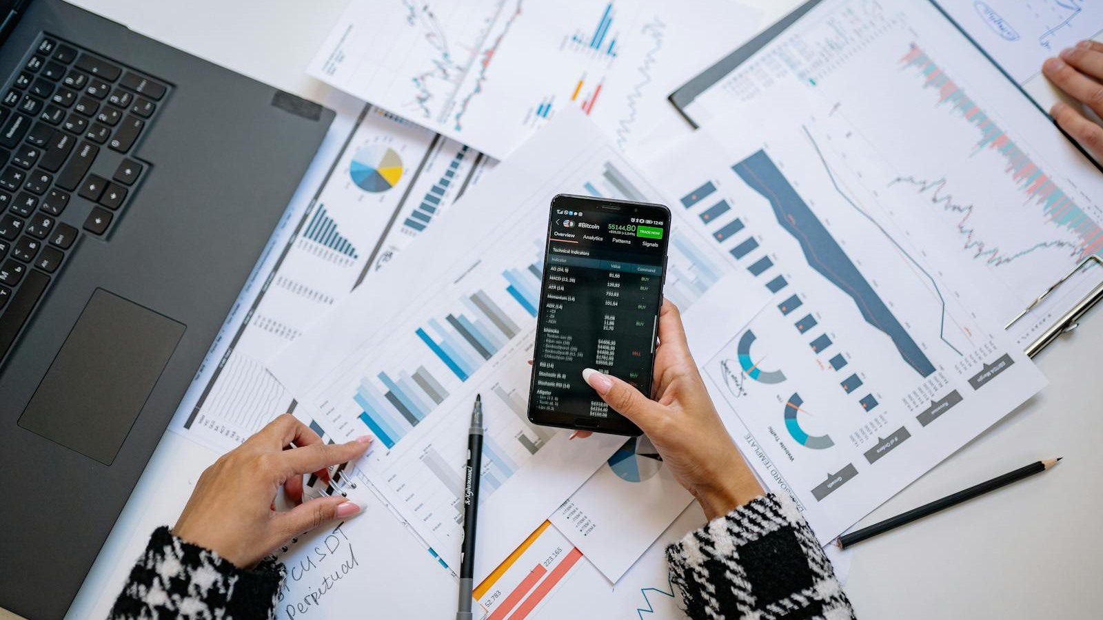 smartphone and charts representing AI data workflow pricing tiers and credits