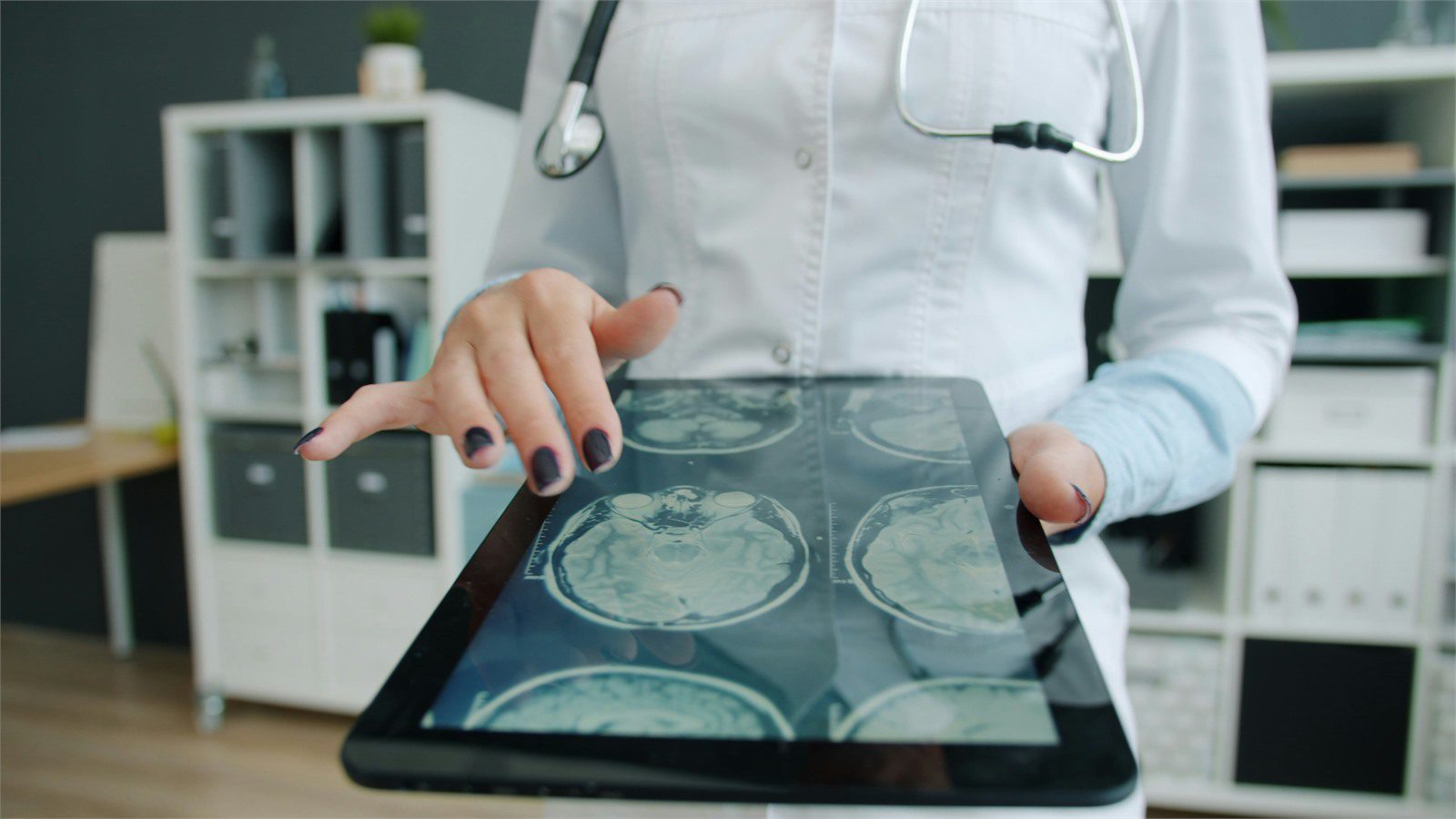 HIPAA-Compliant Software: 9 Critical Wins for Providers 20 doctor showing patient data on a tablet representing backup availability and breach response planning
