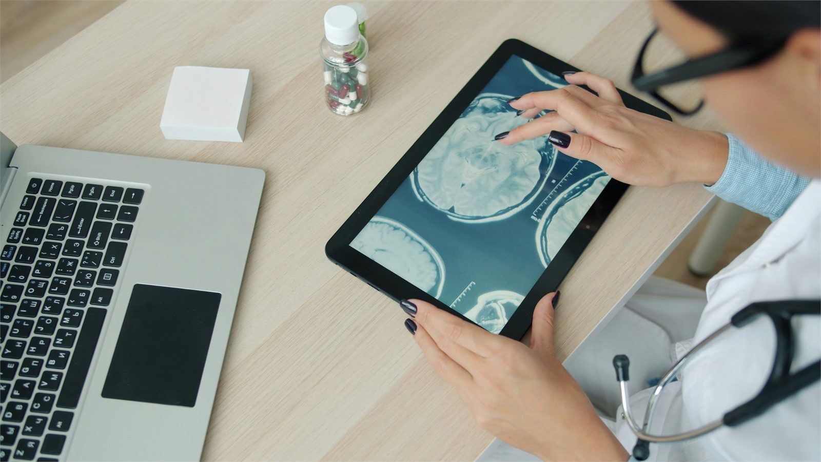HIPAA-Compliant Software: 9 Critical Wins for Providers 14 doctor reviewing patient information on a tablet to map PHI and ePHI data flows