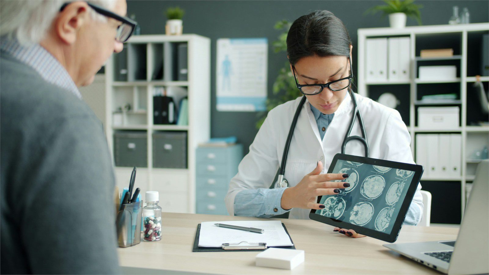 HIPAA-Compliant Software: 9 Critical Wins for Providers 21 doctor reviewing tablet evidence with a patient to represent testing documentation and launch readiness